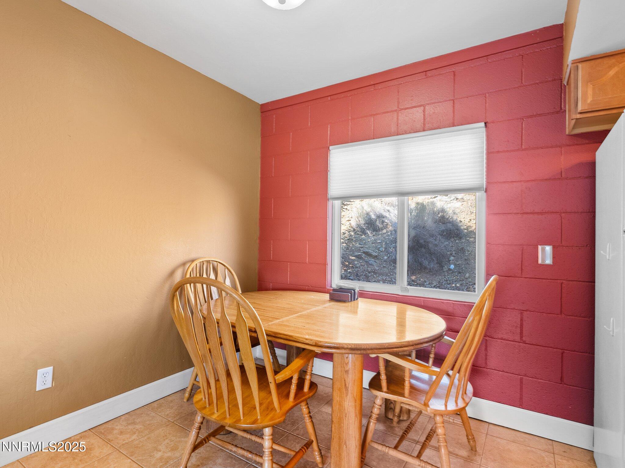 230 Bisset Court, Unit B Reno, NV 89503 - Photo 5 of 14 a view of a dining room with furniture and window
