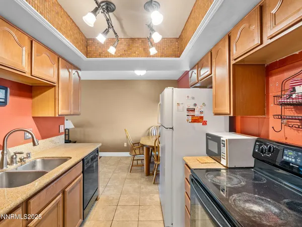 a kitchen with a stove and a refrigerator