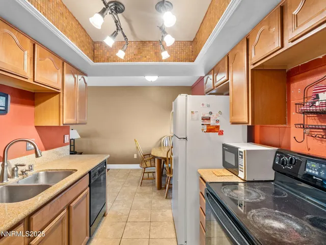 a kitchen with a stove and a refrigerator