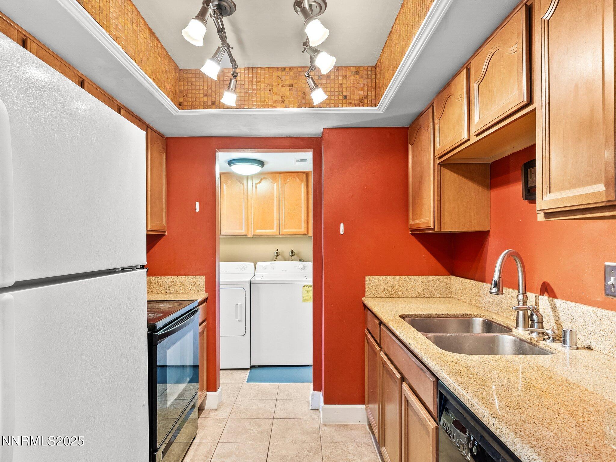 230 Bisset Court, Unit B Reno, NV 89503 - Photo 8 of 14 a kitchen with stainless steel appliances granite countertop a sink a stove and refrigerator