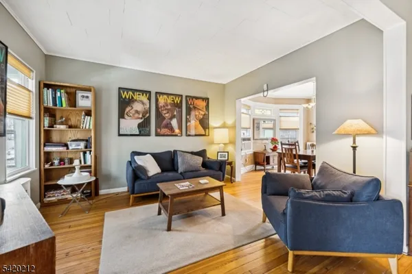 a living room with furniture and a lamp