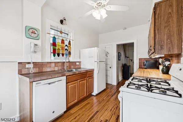 a kitchen with stainless steel appliances a stove and a refrigerator