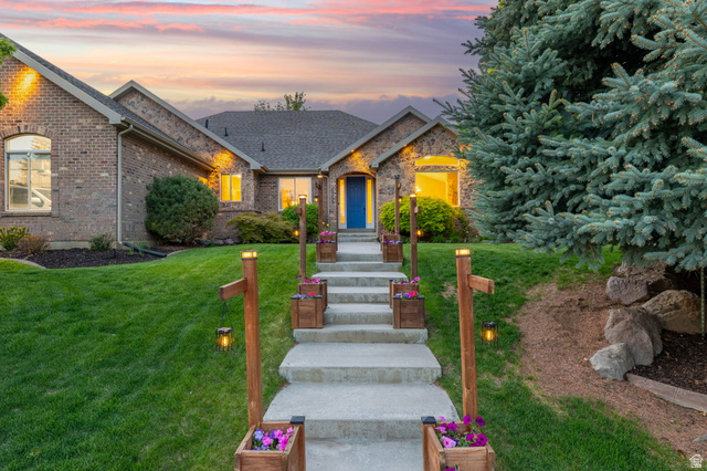 6208 West Bull River Road Highland, UT 84003 - Photo 79 of 90 Brick exterior with a prominent blue entry door