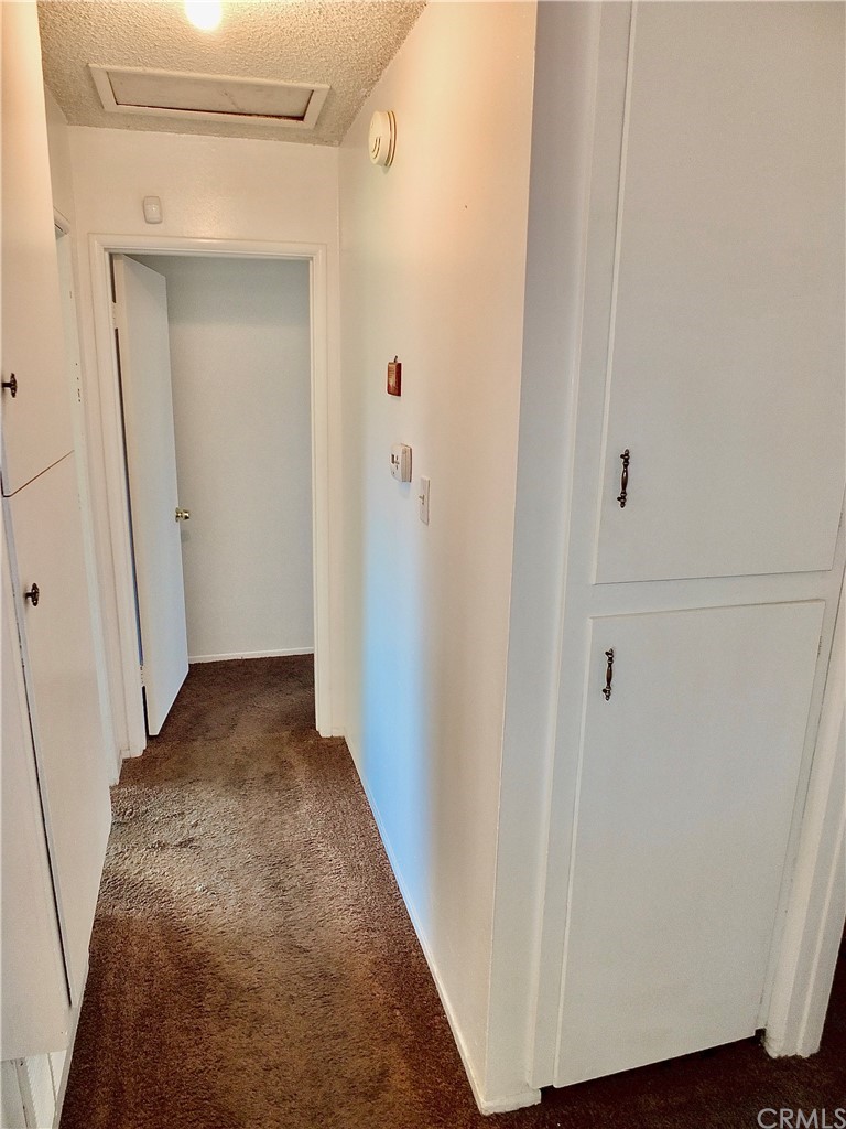 5651 Dean Way Riverside, CA 92504 - Photo 12 of 21 a view of a hallway with wooden floor