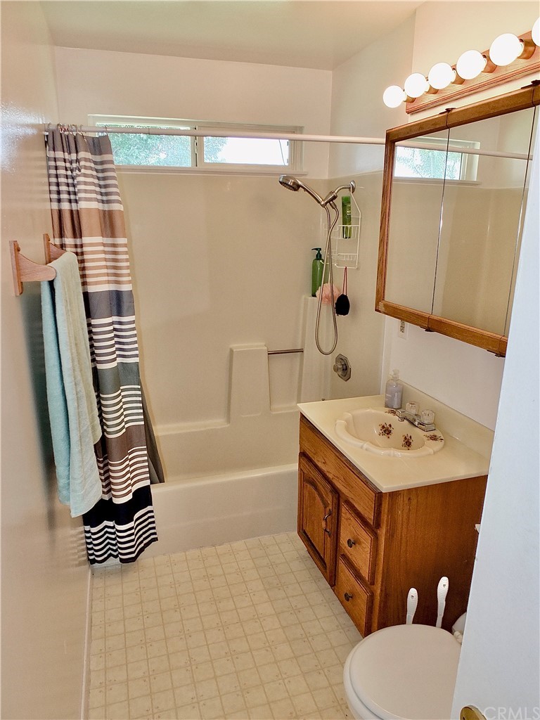 5651 Dean Way Riverside, CA 92504 - Photo 13 of 21 a bathroom with a sink a toilet and a bathtub