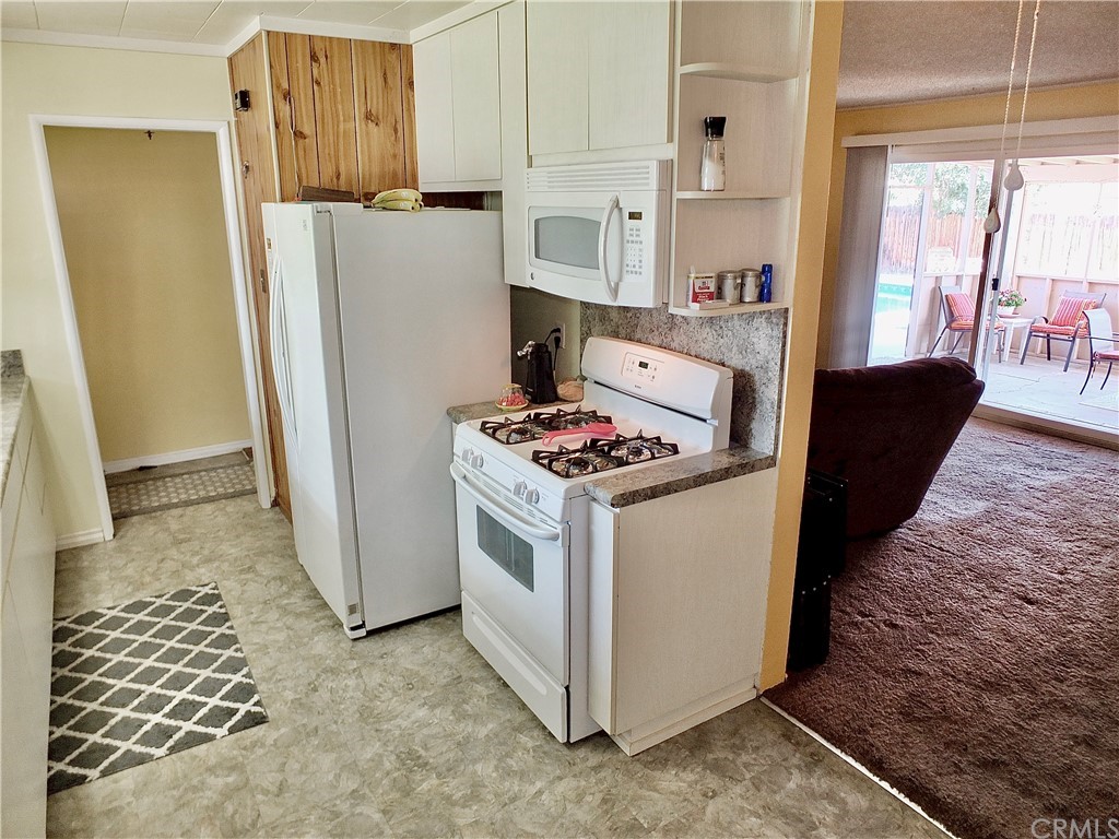 5651 Dean Way Riverside, CA 92504 - Photo 10 of 21 a kitchen with a refrigerator and a stove