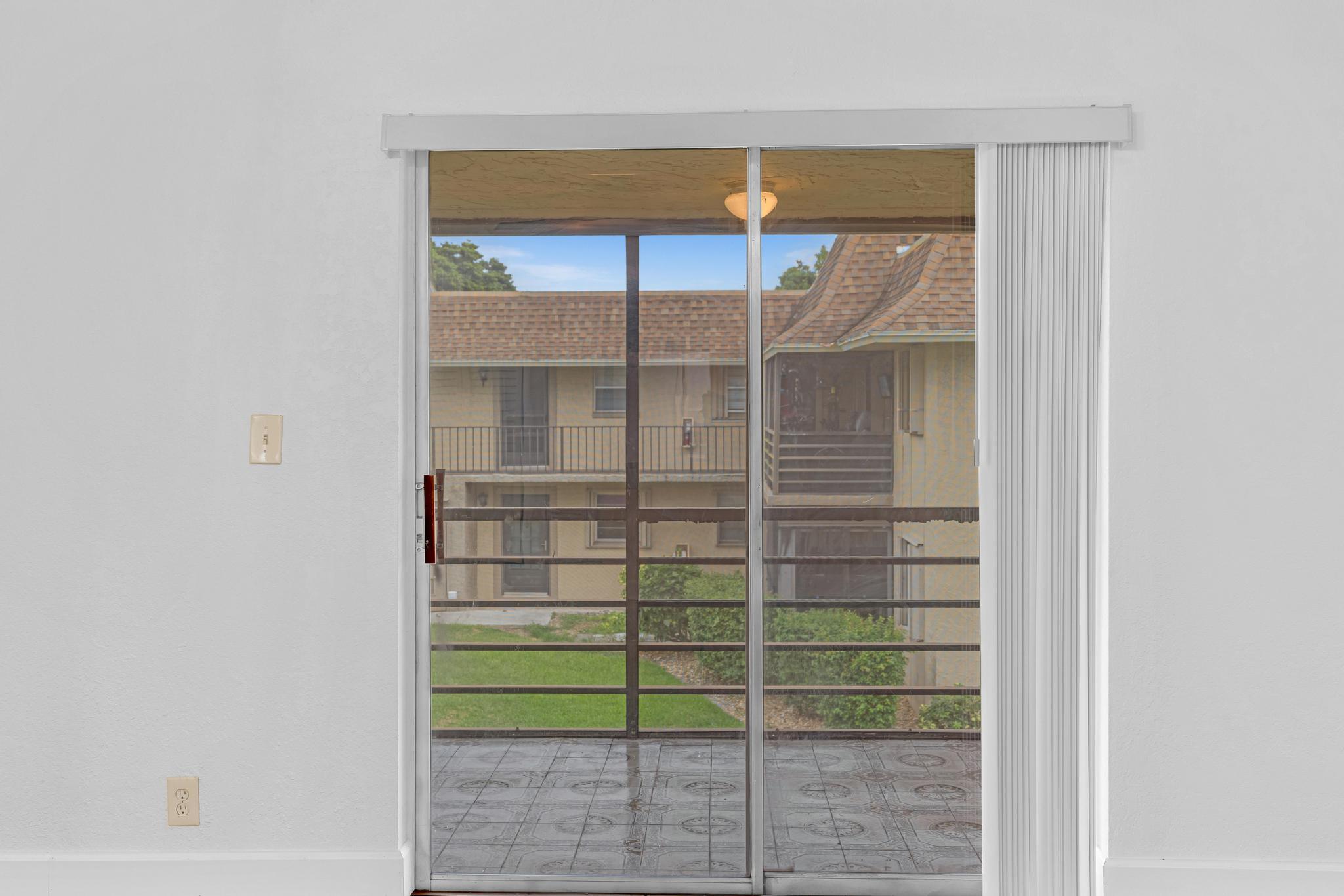 1291 Northwest 13th Street, Unit 445D Boca Raton, FL 33486 - Photo 12 of 50 a view of a room that has a window