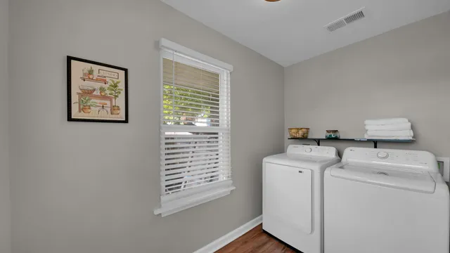 a bathroom with a granite countertop sink toilet bathtub and shower
