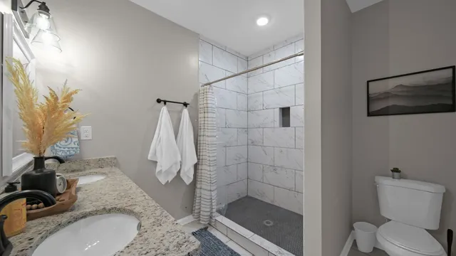 a view of a kitchen and an empty room