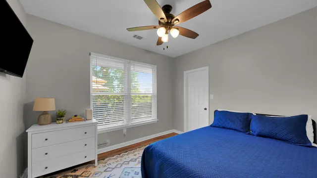 a bathroom with a sink vanity granite and shower