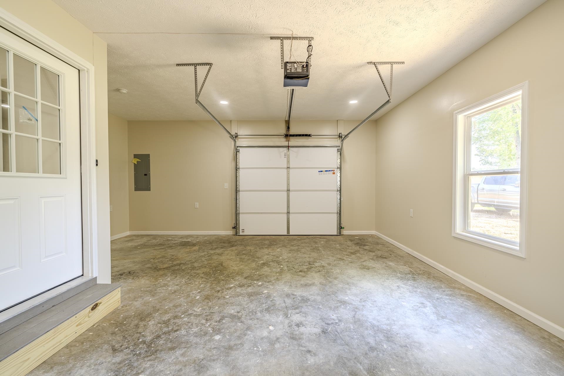 231 Clausel Lane Adamsville, TN 38310 - Photo 25 of 32 an empty room with windows and pillars in it