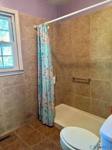 a bathroom with a sink vanity and a mirror