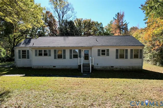 a view of a house with a yard covered with snow in the patio