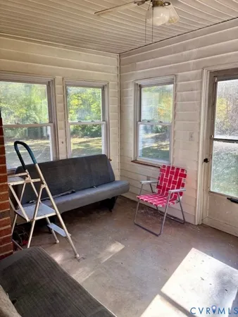 a view of bedroom with furniture and book shelf