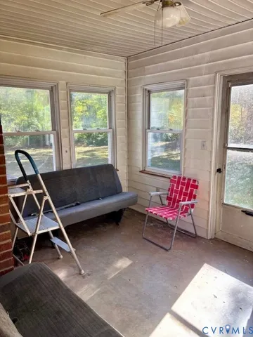 a view of bedroom with furniture and book shelf