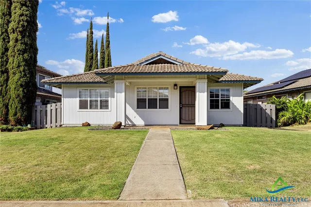 a view of a house with a yard