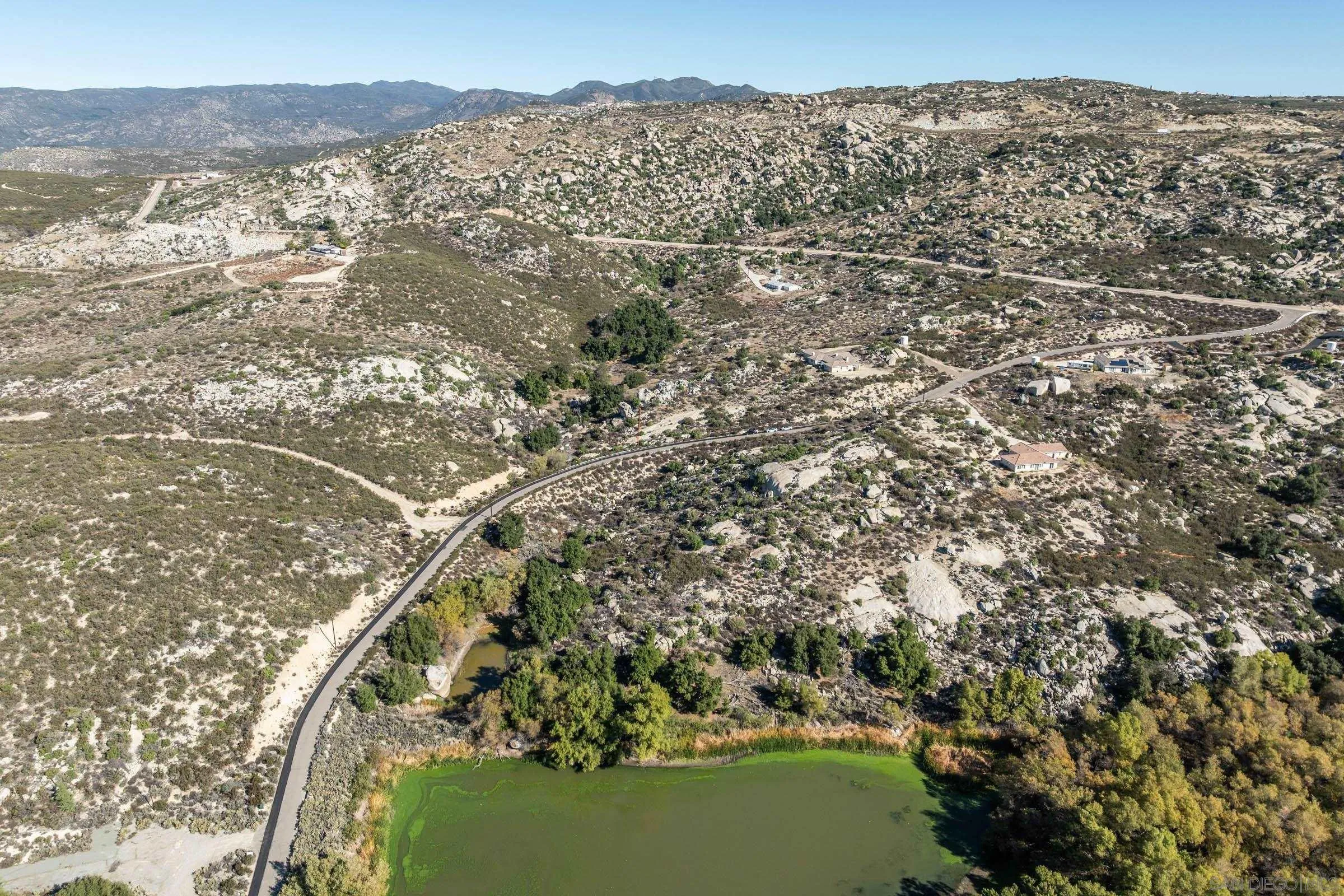 35546 Stagecoach Springs Road, Unit 668 Pine Valley, CA 91962 - Photo 6 of 22 a view of a forest with a lake