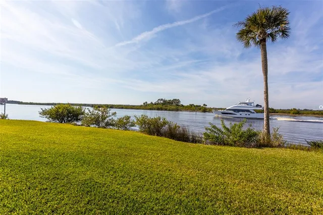 a view of a lake with a big yard