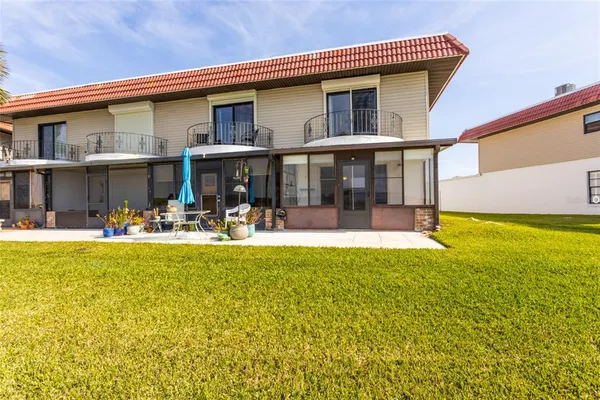a front view of house with swimming pool and outdoor space