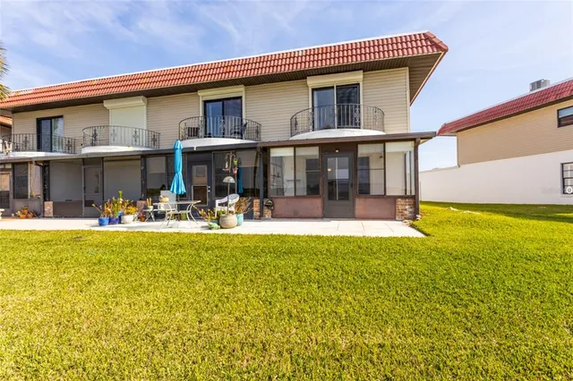 a front view of house with swimming pool and outdoor space