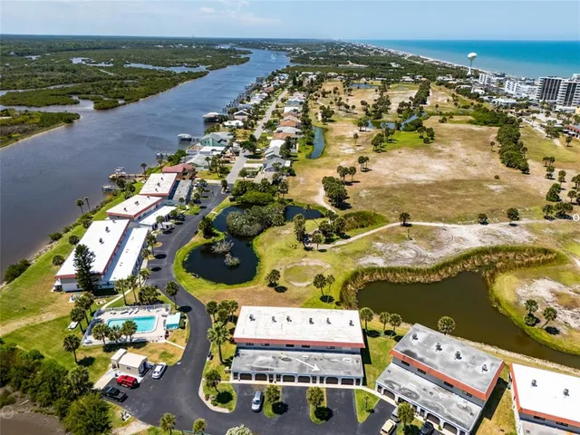 an aerial view of residential houses with outdoor space