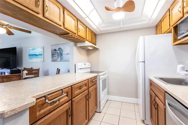 a kitchen with a sink and a refrigerator