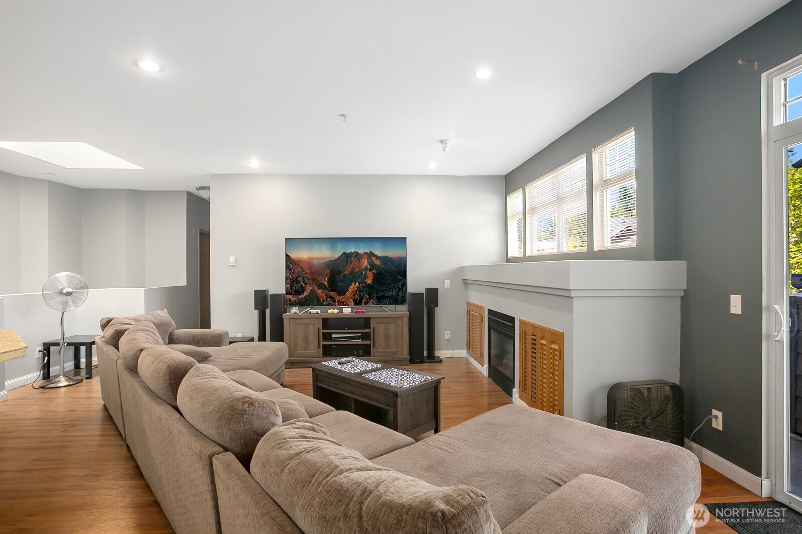 17614 134th Lane Southeast Renton, WA 98058 - Photo 2 of 16 a living room with furniture a flat screen tv and a fireplace