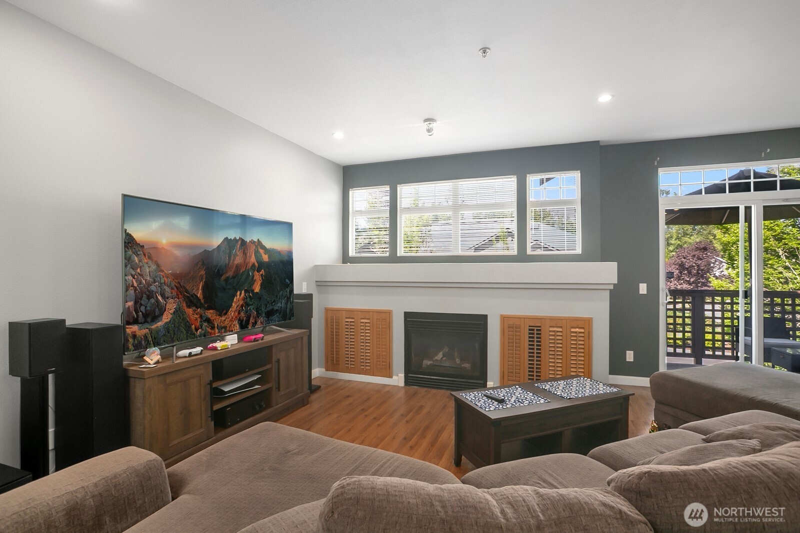 17614 134th Lane Southeast Renton, WA 98058 - Photo 3 of 16 a living room with furniture a flat screen tv and a fireplace