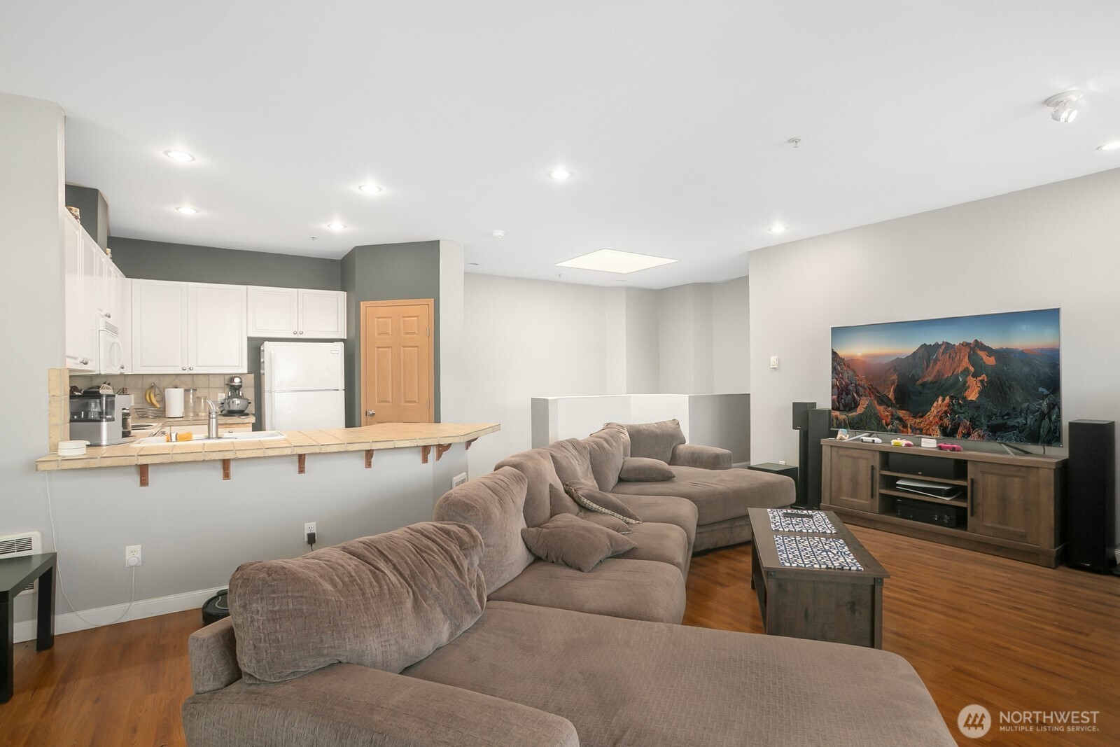 17614 134th Lane Southeast Renton, WA 98058 - Photo 4 of 16 a living room with furniture and a flat screen tv