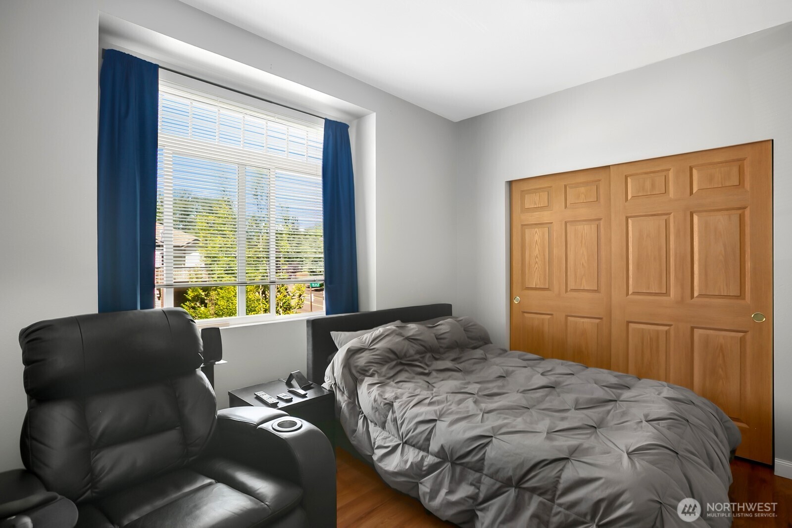 17614 134th Lane Southeast Renton, WA 98058 - Photo 9 of 16 a bedroom with a bed and wooden floor