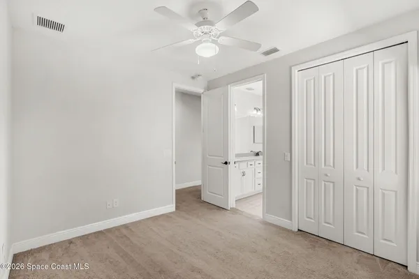 a bathroom with a sink double vanity granite and a mirror