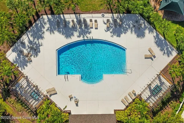 a view of a swimming pool with an ocean view