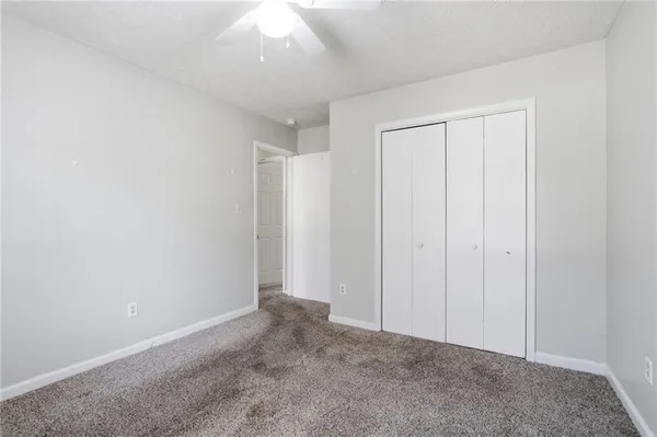 a view of an empty room and entryway