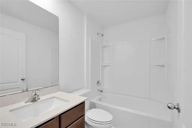 a bathroom with a sink toilet bathtub and vanity
