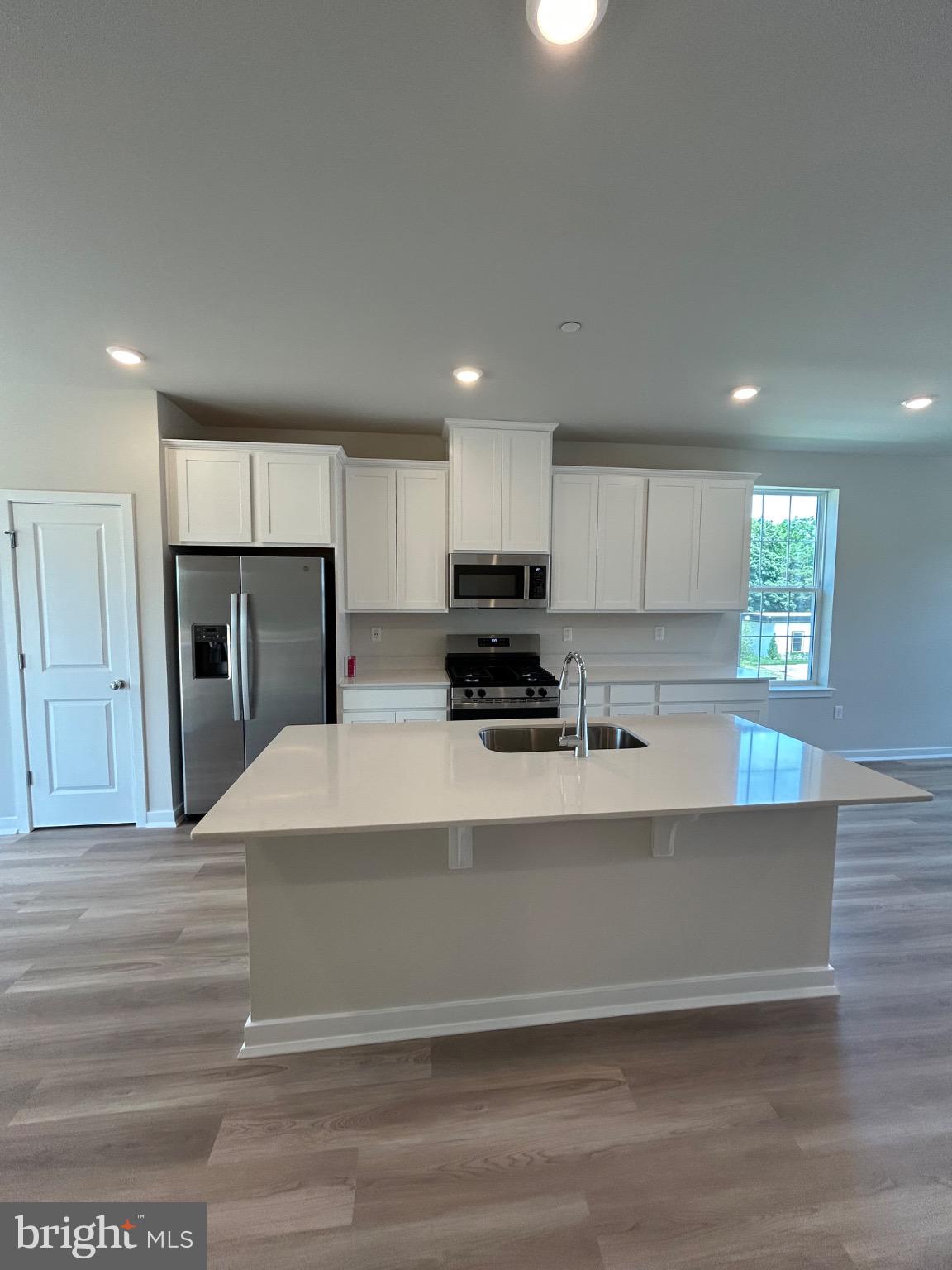 74 Morgans Ml Road Sicklerville, NJ 08081 - Photo 13 of 39 a large kitchen with kitchen island a large counter top and stainless steel appliances