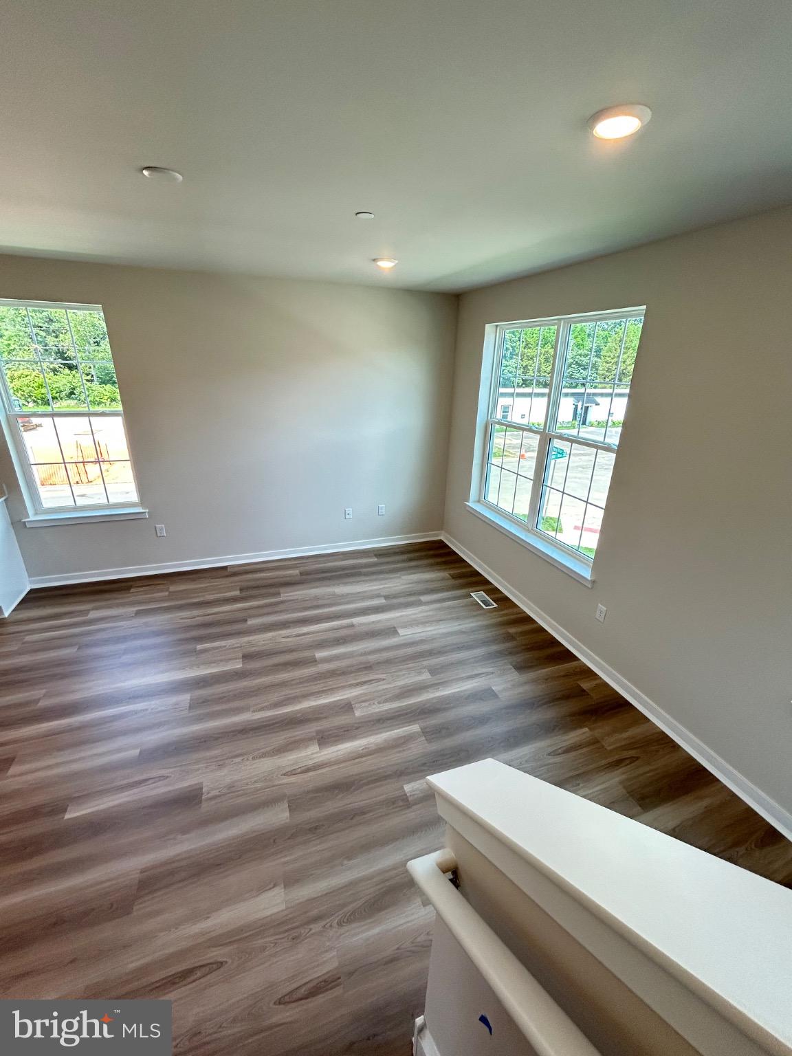 74 Morgans Ml Road Sicklerville, NJ 08081 - Photo 23 of 39 an empty room with wooden floor and windows