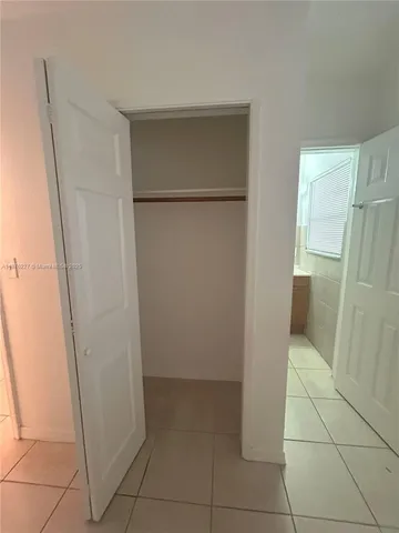 a room with a washing machine with a sink