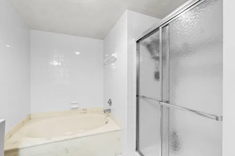 a view of a hallway with washer and dryer
