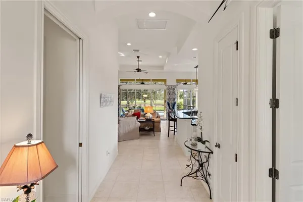 a bathroom with a granite countertop sink a large mirror a and a window