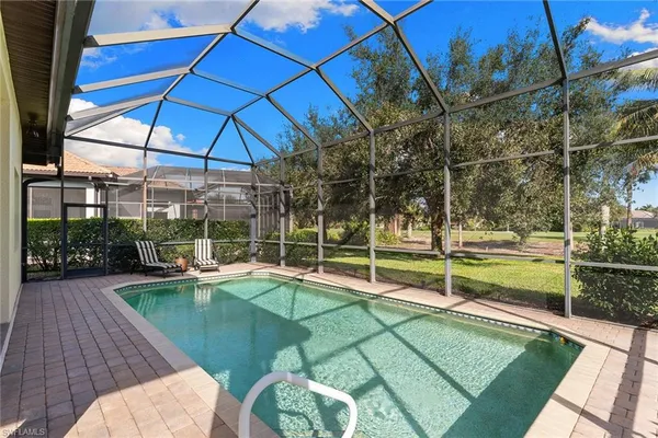 a view of a swimming pool with a patio