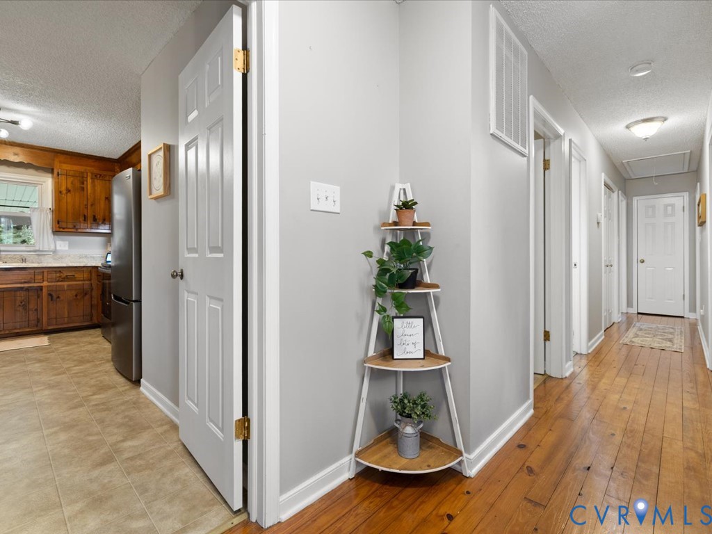 12724 South Chester Road Chester, VA 23831 - Photo 14 of 37 Wood-finish flooring throughout the hallway