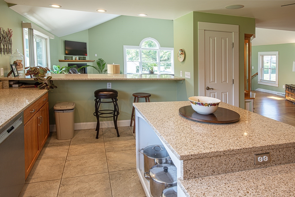 136 Main Street Hatfield, MA 01038 - Photo 12 of 42 a kitchen with a sink a stove and chairs