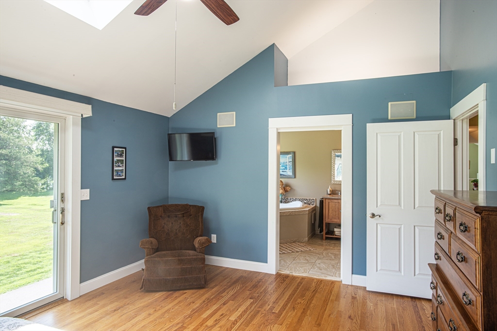 136 Main Street Hatfield, MA 01038 - Photo 20 of 42 a bedroom with furniture and a wooden floor