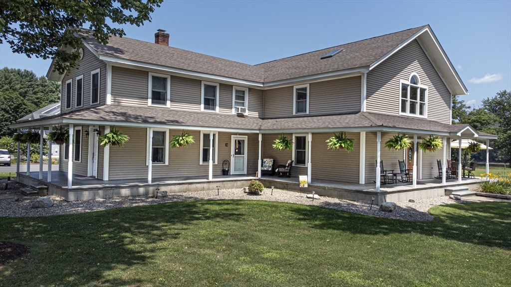 136 Main Street Hatfield, MA 01038 - Photo 2 of 42 a front view of a house with a yard table and chairs