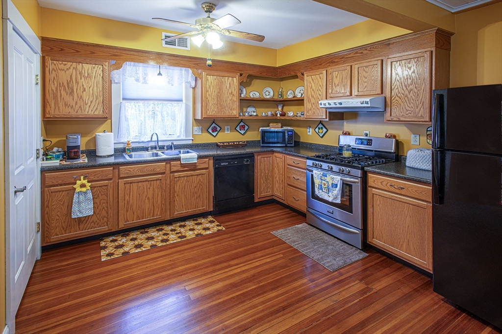 136 Main Street Hatfield, MA 01038 - Photo 33 of 42 a kitchen with stainless steel appliances granite countertop a stove a sink dishwasher and a refrigerator