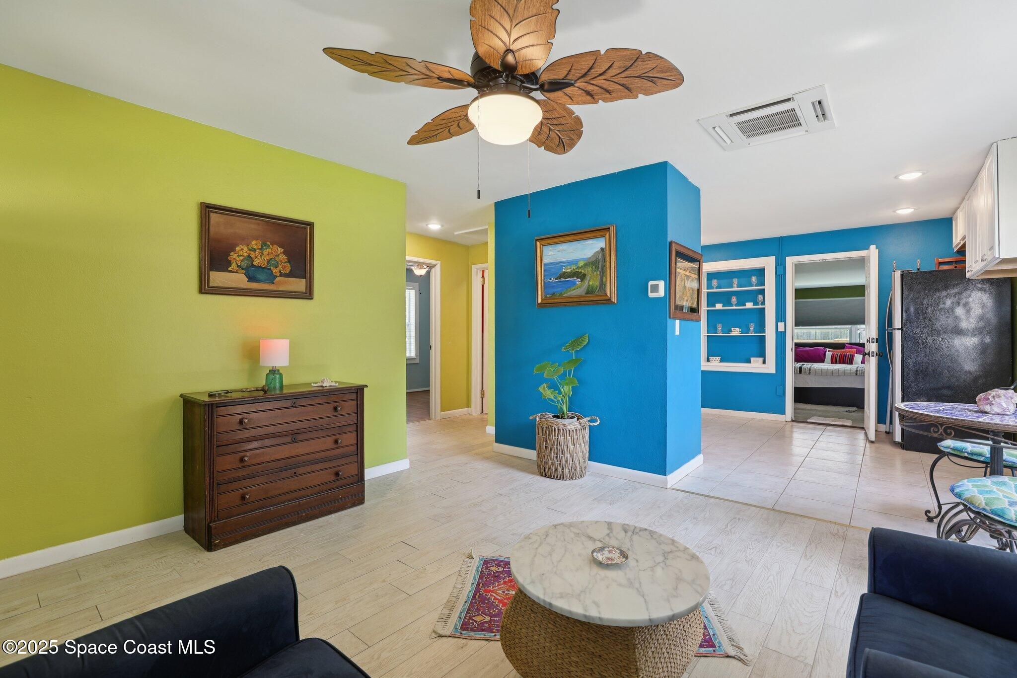 72 Rockledge Avenue Rockledge, FL 32955 - Photo 11 of 28 a living room with furniture and a flat screen tv