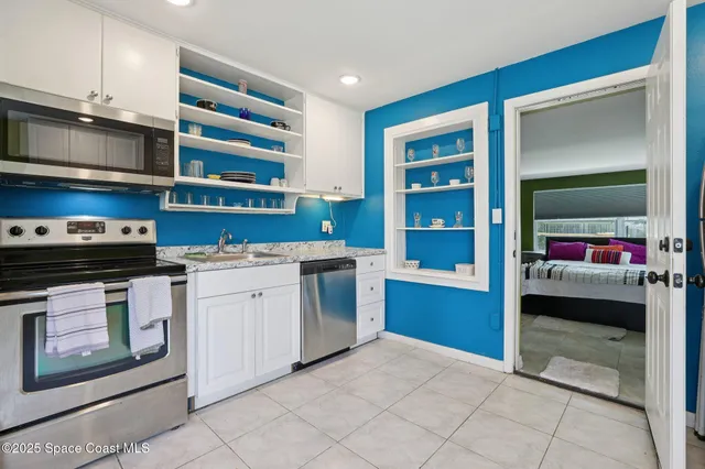 a kitchen with a stove and a cabinets