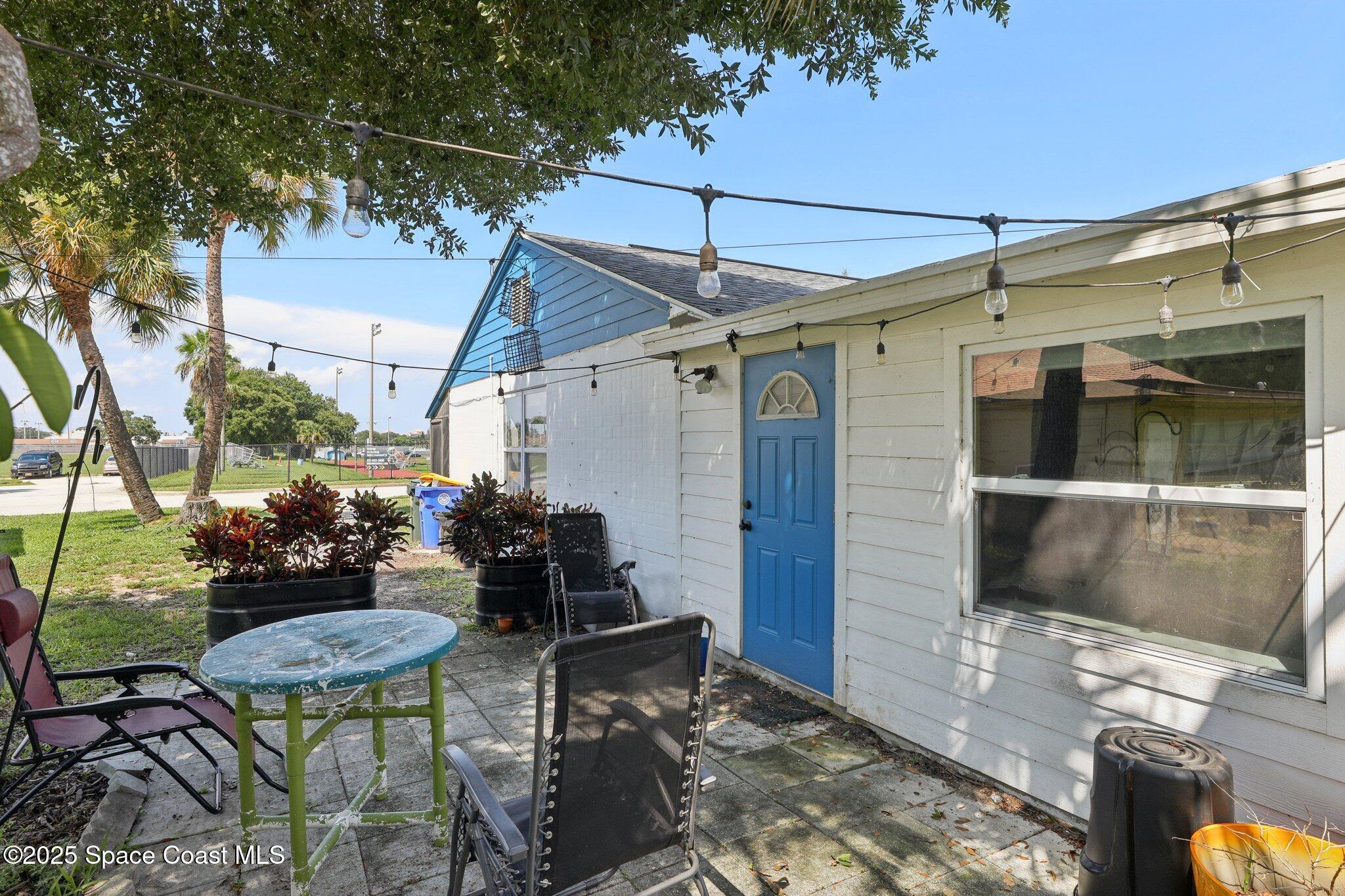 72 Rockledge Avenue Rockledge, FL 32955 - Photo 23 of 28 a view of a patio with table and chairs and potted plants