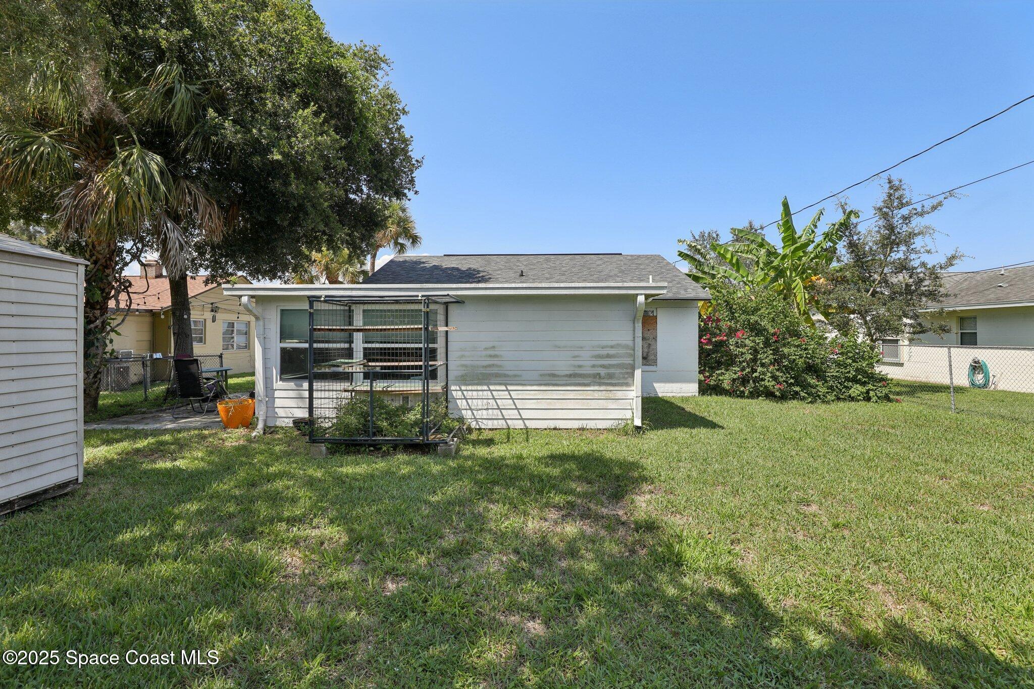 72 Rockledge Avenue Rockledge, FL 32955 - Photo 25 of 28 a view of a house with yard and a garden