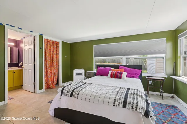 a bedroom with a bed and a table